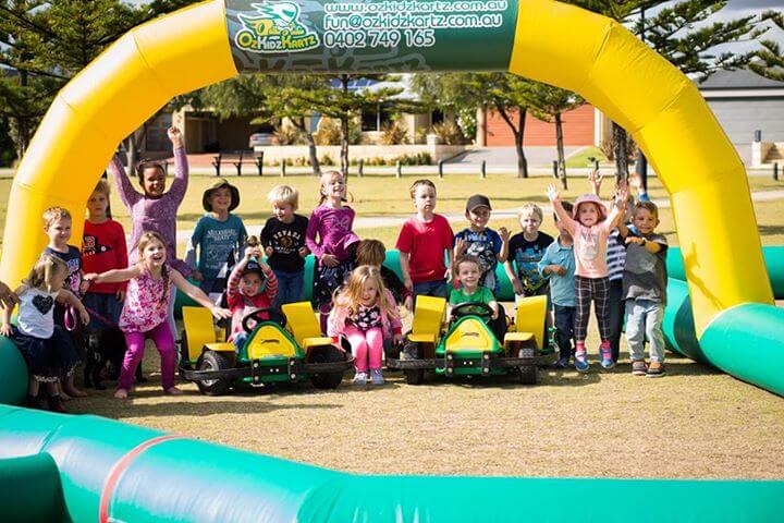 A group photo at another Kids go kart event where kids are having lots of fun